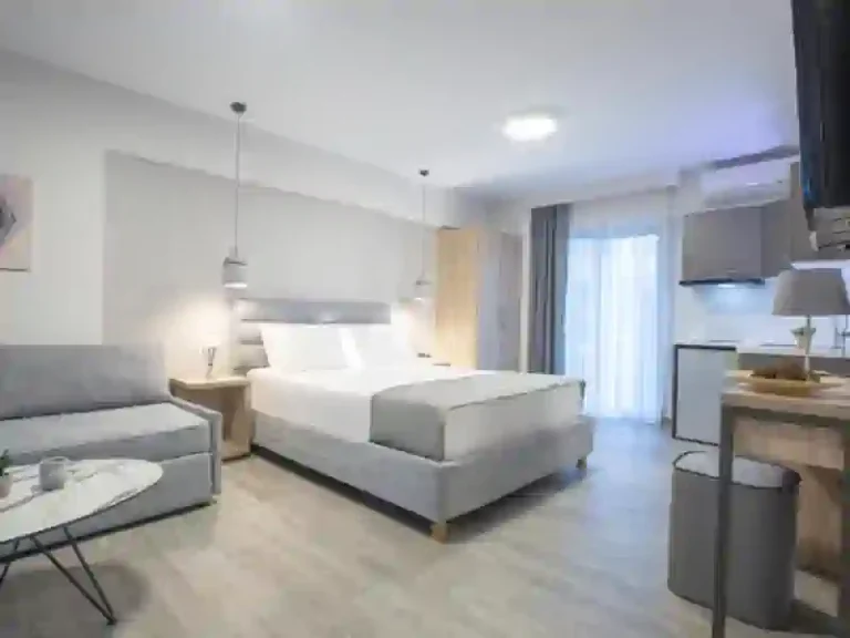Studio at KN Suites with a double bed and kitchenette
