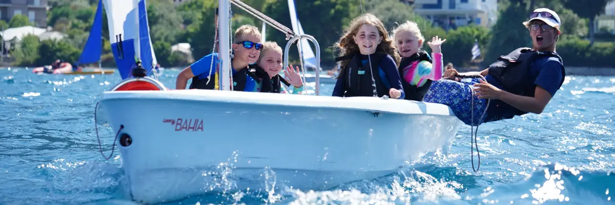 Children sailing a Laser Bahia with their instructor in the Nikiana Beach Club kids club